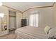Bright bedroom featuring a striped bedspread and dresser at 501 E Ray Rd # 211, Chandler, AZ 85225