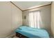 Small bedroom with a twin bed and large window at 501 E Ray Rd # 211, Chandler, AZ 85225
