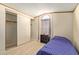 Bedroom with a twin bed, large closet, and wood-look floors at 501 E Ray Rd # 211, Chandler, AZ 85225