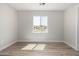 Spacious bedroom featuring wood-look floors and a window with a view at 14659 N Riverview Ct, Florence, AZ 85132