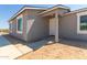 Side view of a newly constructed home with a covered entryway at 14659 N Riverview Ct, Florence, AZ 85132