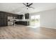 Open living room and kitchen area with wood-look floors at 14659 N Riverview Ct, Florence, AZ 85132