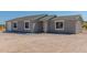 Newly built home with gray siding and attached garage at 14659 N Riverview Ct, Florence, AZ 85132