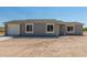 Newly built home with gray siding and attached garage at 14659 N Riverview Ct, Florence, AZ 85132