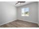 Bright bedroom with wood-look floors and a window at 14659 N Riverview Ct, Florence, AZ 85132