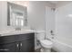 Clean bathroom with white subway tile and dark vanity at 14659 N Riverview Ct, Florence, AZ 85132