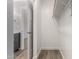Bright walk-in closet with wood-look floors and hanging rod at 14659 N Riverview Ct, Florence, AZ 85132