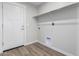 Laundry room with built-in shelving and hookups at 14659 N Riverview Ct, Florence, AZ 85132