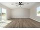 Bright bedroom with wood-look floors and large window at 14659 N Riverview Ct, Florence, AZ 85132