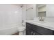 Clean bathroom, featuring a white tub and dark vanity at 14659 N Riverview Ct, Florence, AZ 85132