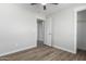 Bedroom with wood-look floors and access to closet and hallway at 14659 N Riverview Ct, Florence, AZ 85132