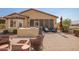 Outdoor entertainment area with screened patio, built-in grill, and seating at 17540 W Glenhaven Dr, Goodyear, AZ 85338
