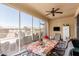 Covered patio with table and seating area at 17540 W Glenhaven Dr, Goodyear, AZ 85338