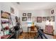 Home office features built-in shelving and a comfortable chair at 17540 W Glenhaven Dr, Goodyear, AZ 85338
