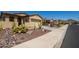 Two-story home with desert landscaping and driveway at 17540 W Glenhaven Dr, Goodyear, AZ 85338