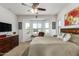 Comfortable bedroom with bay windows and ceiling fan at 17540 W Glenhaven Dr, Goodyear, AZ 85338