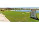 Welcome sign for CantaMia community, showcasing homes and village center at 17540 W Glenhaven Dr, Goodyear, AZ 85338