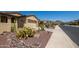 Two-story home with desert landscaping and driveway at 17540 W Glenhaven Dr, Goodyear, AZ 85338