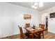 Bright dining room featuring a wood table with four chairs at 17540 W Glenhaven Dr, Goodyear, AZ 85338