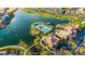 Aerial view of community with lake and pool at 17540 W Glenhaven Dr, Goodyear, AZ 85338