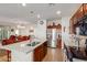 Open concept kitchen with an island and stainless steel appliances at 17540 W Glenhaven Dr, Goodyear, AZ 85338