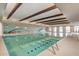 Inviting indoor swimming pool with seating area at 17540 W Glenhaven Dr, Goodyear, AZ 85338