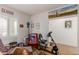 Home office with exercise bike and plenty of storage at 17540 W Glenhaven Dr, Goodyear, AZ 85338