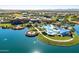 Aerial view of community with lake, pool, and clubhouse at 17540 W Glenhaven Dr, Goodyear, AZ 85338