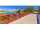 Picturesque red footbridge over a serene pond in the community at 17540 W Glenhaven Dr, Goodyear, AZ 85338