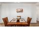 Simple dining room with a wood table and chairs at 17540 W Glenhaven Dr, Goodyear, AZ 85338