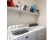 Laundry room with Maytag washer and dryer at 17540 W Glenhaven Dr, Goodyear, AZ 85338