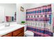 Clean bathroom with patterned shower curtain at 17540 W Glenhaven Dr, Goodyear, AZ 85338