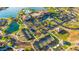 Community overview featuring pools, tennis courts, and lake at 17540 W Glenhaven Dr, Goodyear, AZ 85338