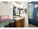 Clean bathroom with vanity, mirror, and window at 18535 W Udall Dr, Surprise, AZ 85374