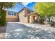 Two-story house with attached garage and landscaping at 18535 W Udall Dr, Surprise, AZ 85374