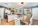 Bright kitchen with island, stainless steel appliances, and ample cabinetry at 18535 W Udall Dr, Surprise, AZ 85374