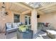 Covered patio with comfortable seating, creating an inviting outdoor space at 18535 W Udall Dr, Surprise, AZ 85374