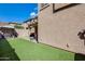View of the backyard with artificial turf and a block wall at 18535 W Udall Dr, Surprise, AZ 85374