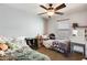 Spacious bedroom with two twin beds, a desk, and a large window at 18535 W Udall Dr, Surprise, AZ 85374