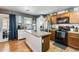 Kitchen features an island, stainless steel appliances, and ample cabinet space at 18535 W Udall Dr, Surprise, AZ 85374