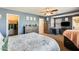 Spacious bedroom with a walk-in closet and ceiling fan at 18535 W Udall Dr, Surprise, AZ 85374