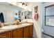 Bathroom with double sinks, updated fixtures, and natural light at 18535 W Udall Dr, Surprise, AZ 85374