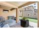 Patio with seating area, grill, and lush green lawn at 18535 W Udall Dr, Surprise, AZ 85374