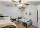Well-lit bedroom with two twin beds, nightstands, and ample closet space at 18535 W Udall Dr, Surprise, AZ 85374
