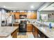 Kitchen features stainless steel appliances and wood cabinets at 18535 W Udall Dr, Surprise, AZ 85374