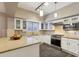 Updated kitchen featuring granite countertops and stainless steel appliances at 514 S Marina Dr, Gilbert, AZ 85233