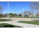 Sand volleyball court with surrounding grass and trees at 514 S Marina Dr, Gilbert, AZ 85233