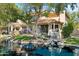 Charming home with a waterfront view and lush landscaping at 514 S Marina Dr, Gilbert, AZ 85233