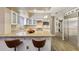 Modern kitchen with granite countertops, stainless steel appliances, and white cabinets at 514 S Marina Dr, Gilbert, AZ 85233