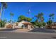 Gated community entrance with palm trees and flag at 514 S Marina Dr, Gilbert, AZ 85233